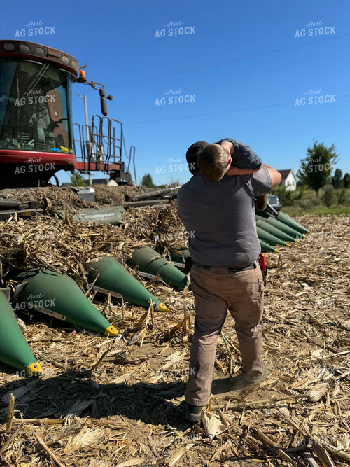 Farmer and Son Playing by Combine 228026