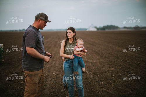 Farm Family Talking in Field at Planting 5675