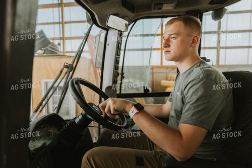 Young Farmer Drives Tractor 7548