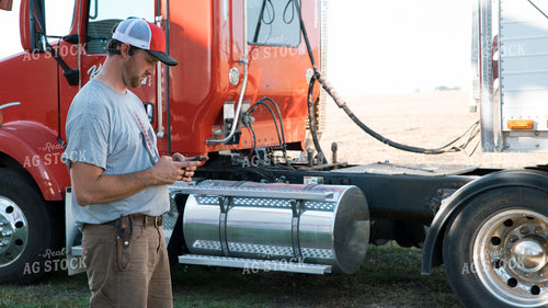 Farmer Using Phone 26100