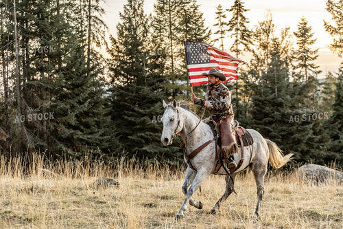Cowboy on Horseback with American Flag 188145