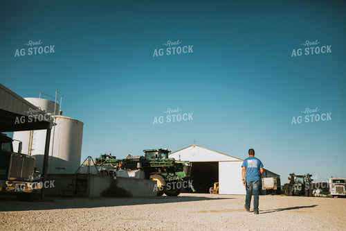 Farmer Walking in Farm Yard 6216
