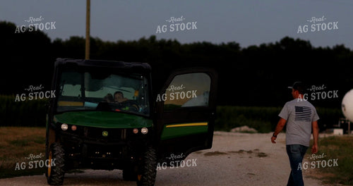 Farmer Climbing into Gator at Dusk 6500