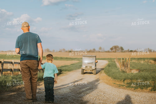Farmer and Farm Kid Walking Down Road 7410
