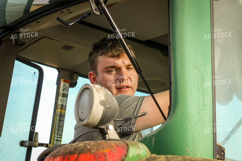 Farmer Driving Tractor 155094