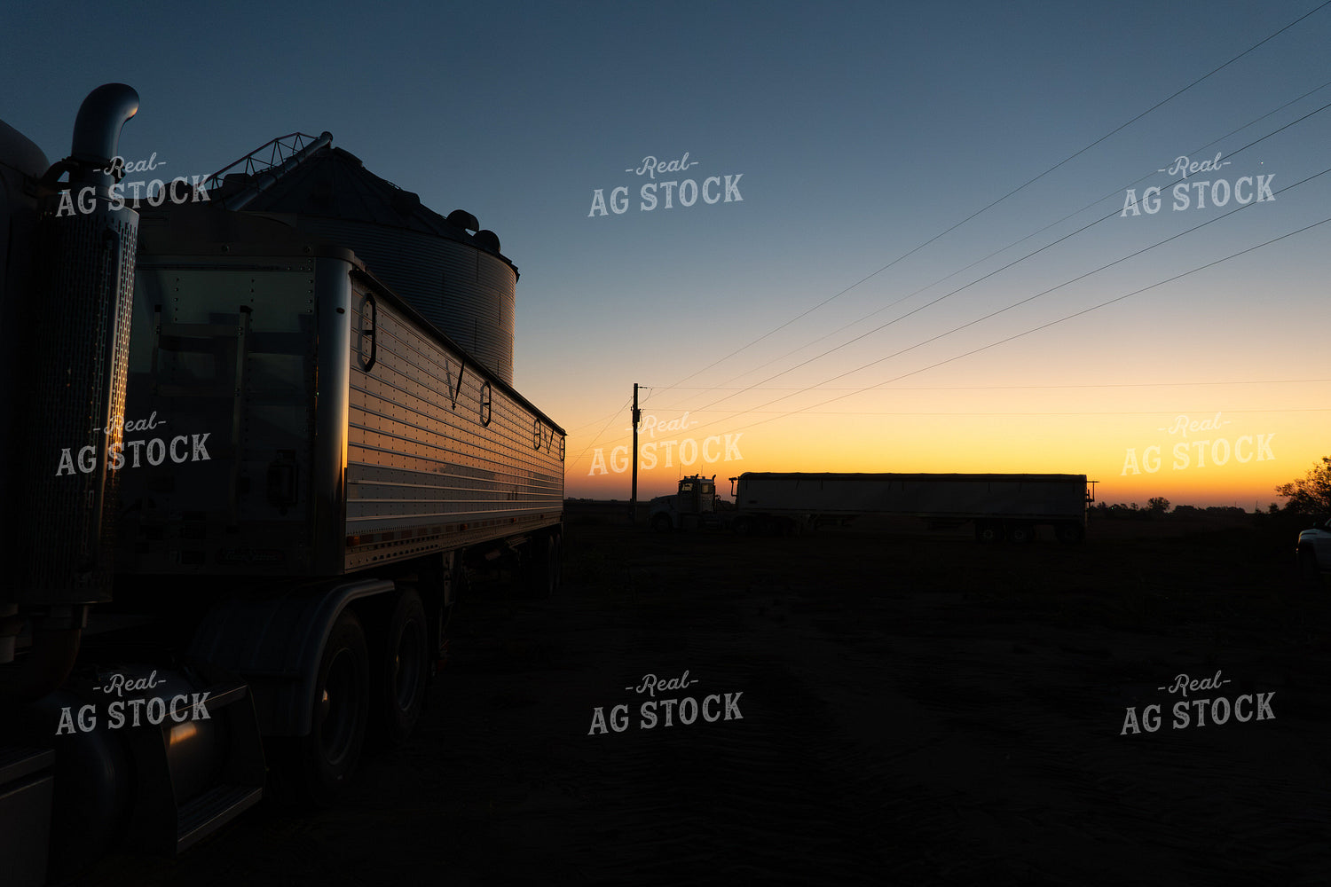 Grain Bin Site with Semi at Sunset 65516