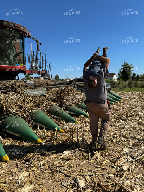 Farmer and Son Playing by Combine 228027