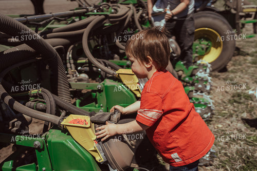 Farm Kid Helps with Test Plot 196116