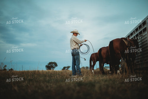 Rancher with Horses Near Livestock Trailer 6441