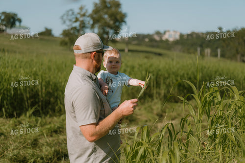 Farmer Checking Crops with Farm Kid 125403