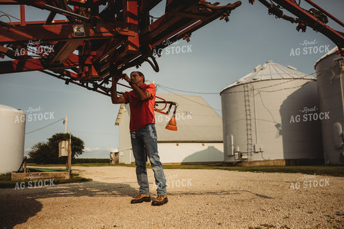 Farmer Checking Sprayer Nozzles 4451