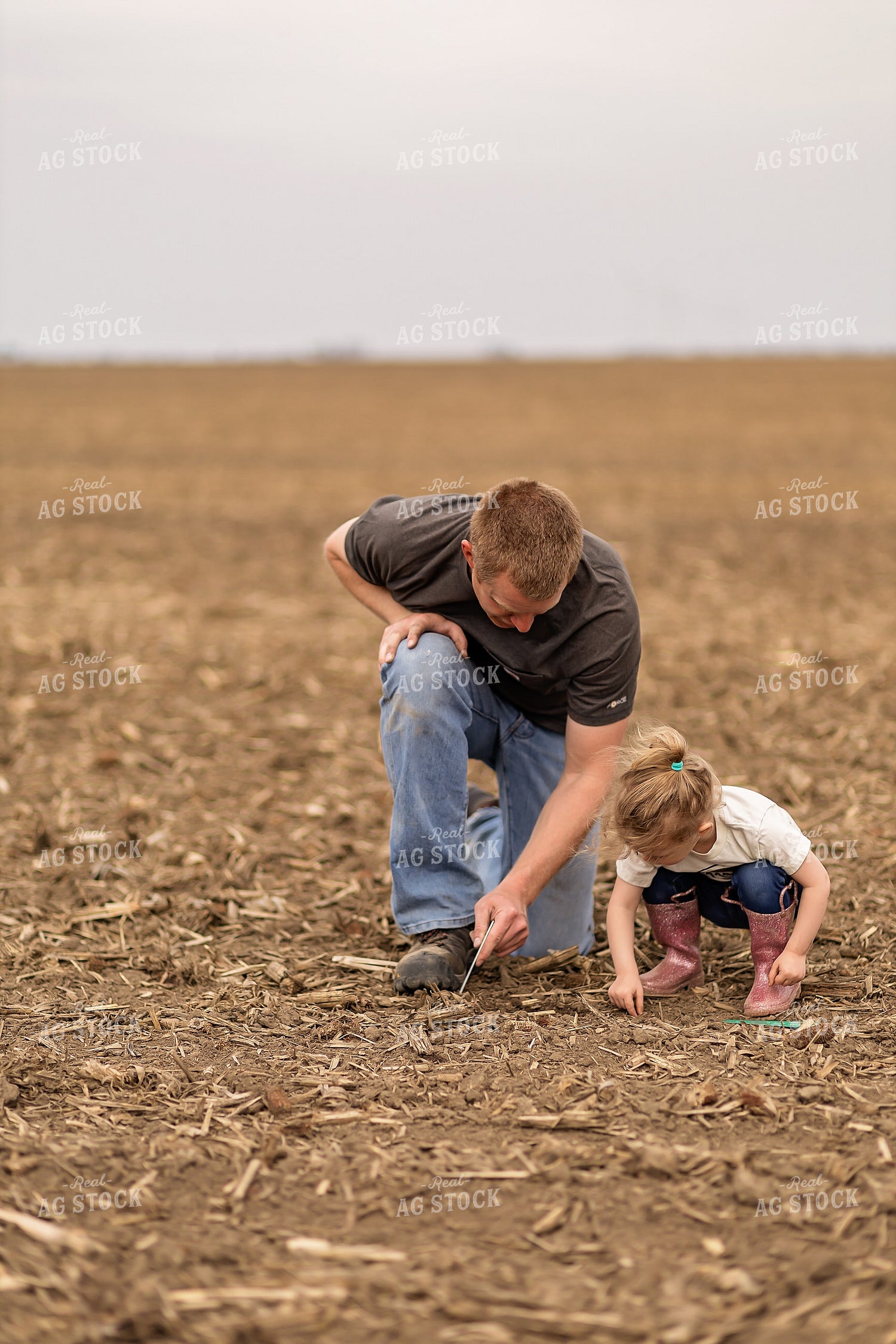 Farmer and Daughter Checking Soybeans 93304