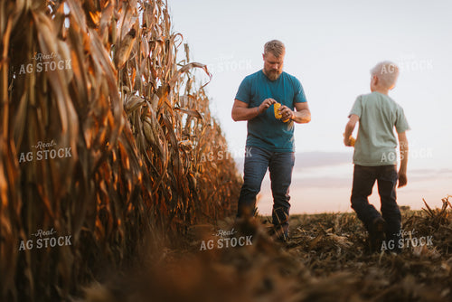 Farmer Checking Corn with Kid 9400