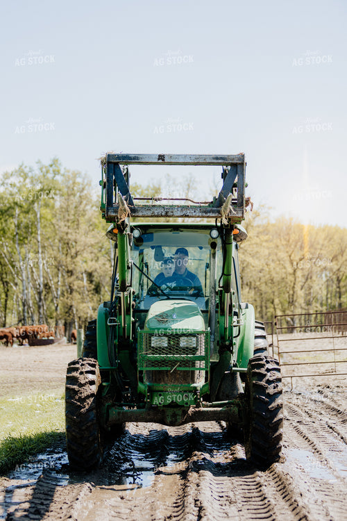 Farmer and Grandson in Tractor 234015