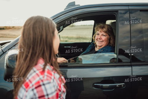 Female Farmer Talking to Farm Mom in Pickup Truck 3530