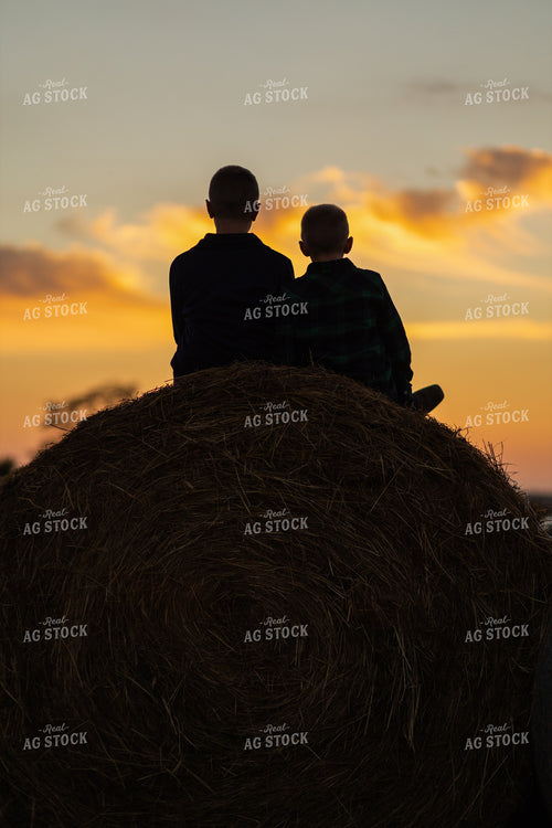 Farm Kids on Hay Bale at Sunset 93373