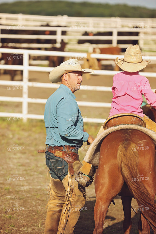 Rancher Teaching Kid to Ride Horseback 127036