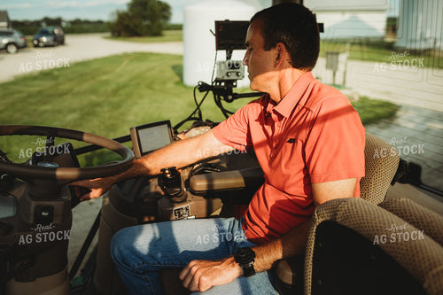 Farmer inside Tractor Cab with Monitors 4458