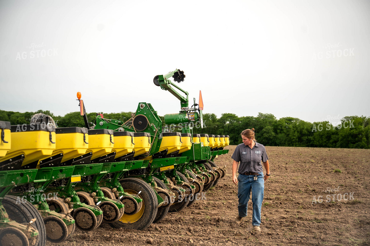 Female Farmer Walking by Planter 115658