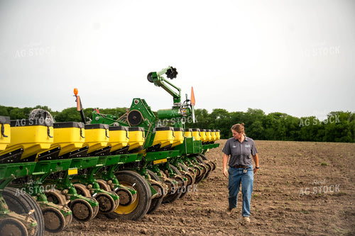 Female Farmer Walking by Planter 115658