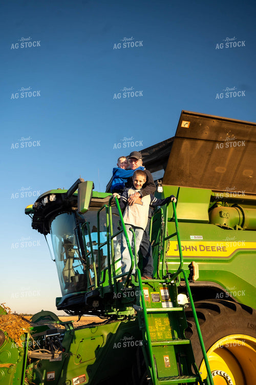 Farmer and Farm Kids on Combine 115595