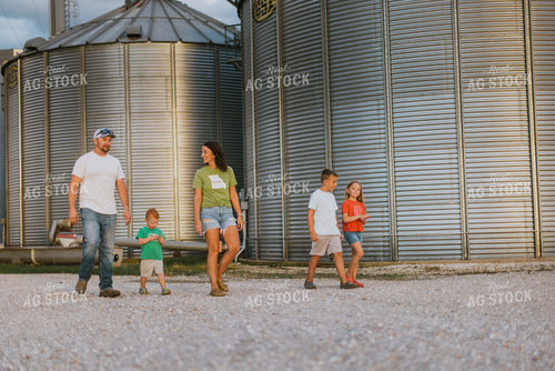 Farm Family Walking by Grain Bins 8779