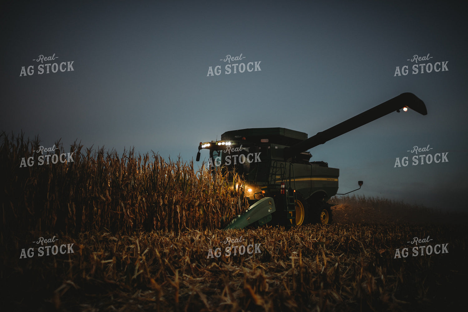 Combine Picking Corn with Lights On at Dusk 3405