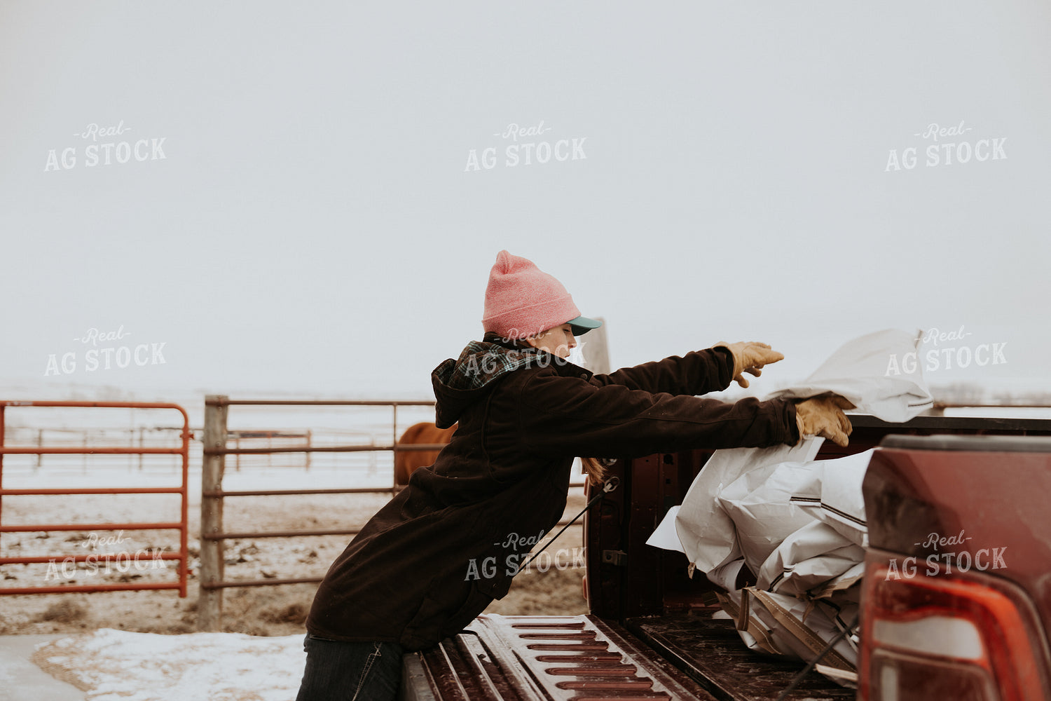 Female Rancher Carrying Feed Bag 61184