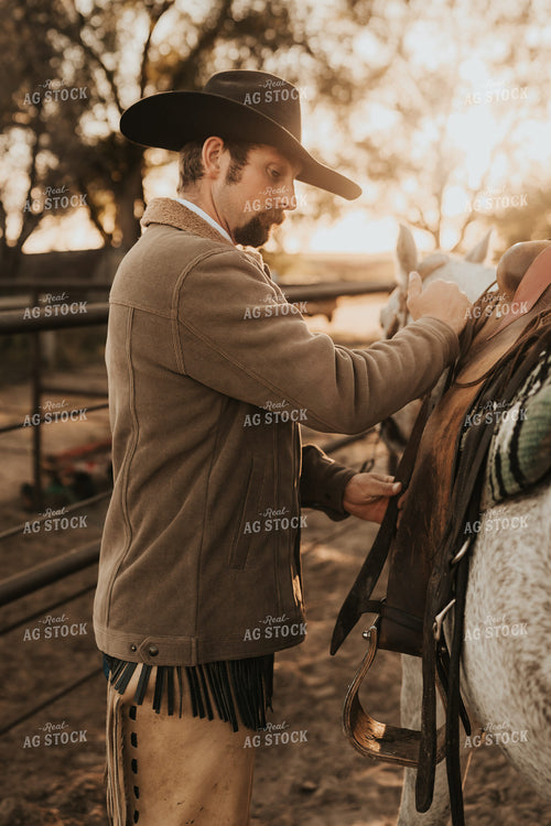 Cowboy Saddling Horse 61183