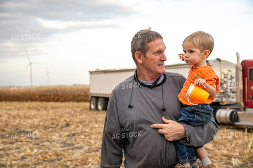 Grandson and Grandfather Farmer in Field 25827
