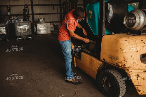 Farmer Working on Equipment 4516