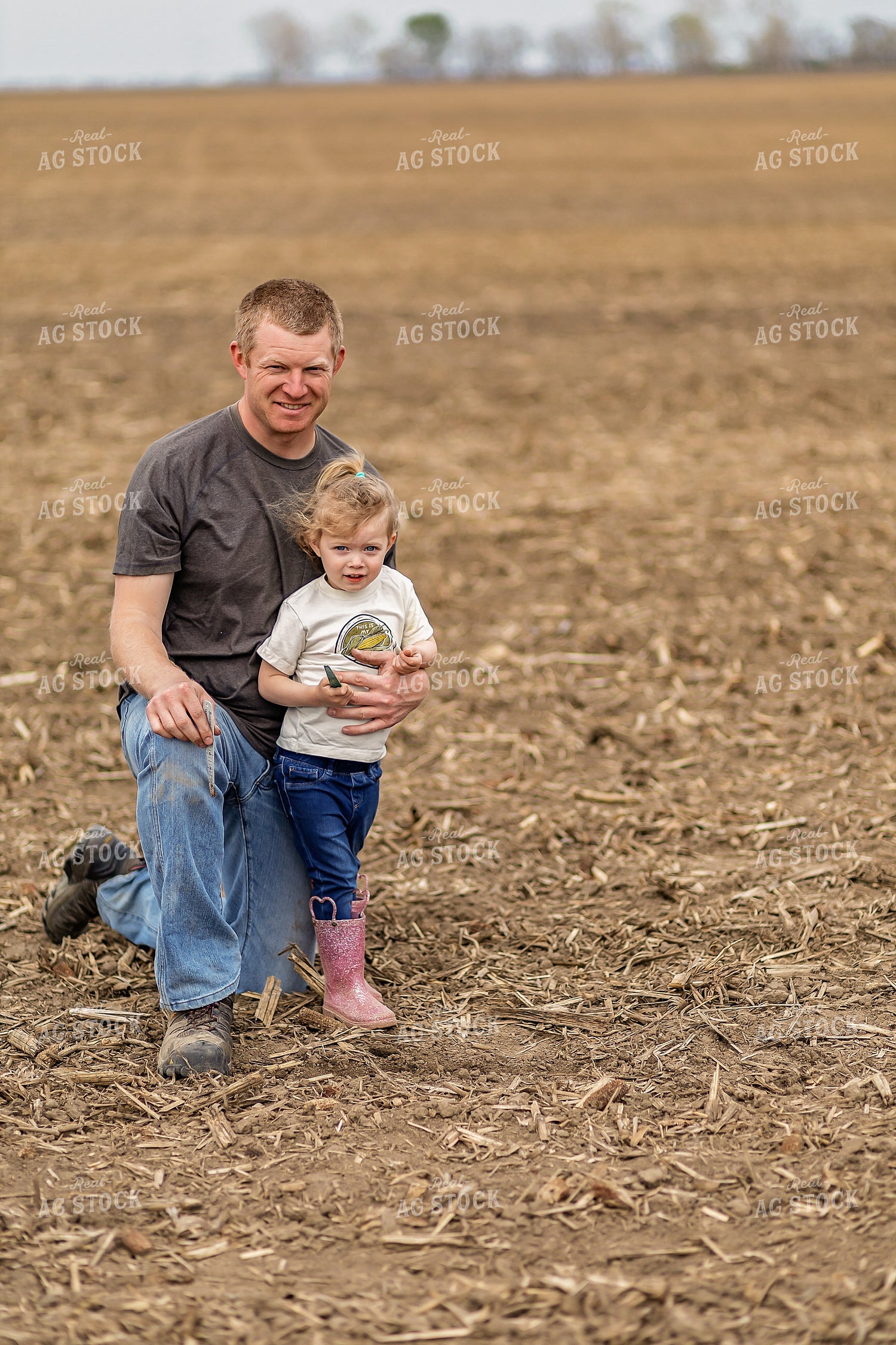 Farmer and Daughter Checking Soybeans 93310