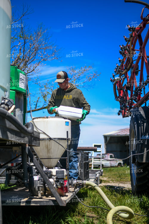 Farmer Mixing Chemicals for Self Propelled Sprayer 191067