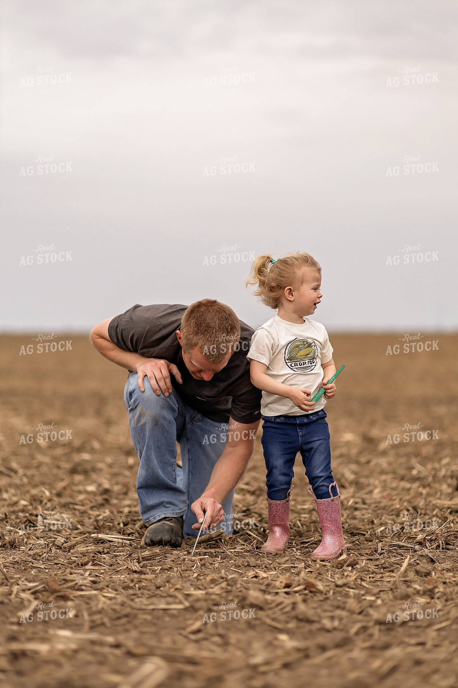Farmer and Daughter Checking Soybeans 93302