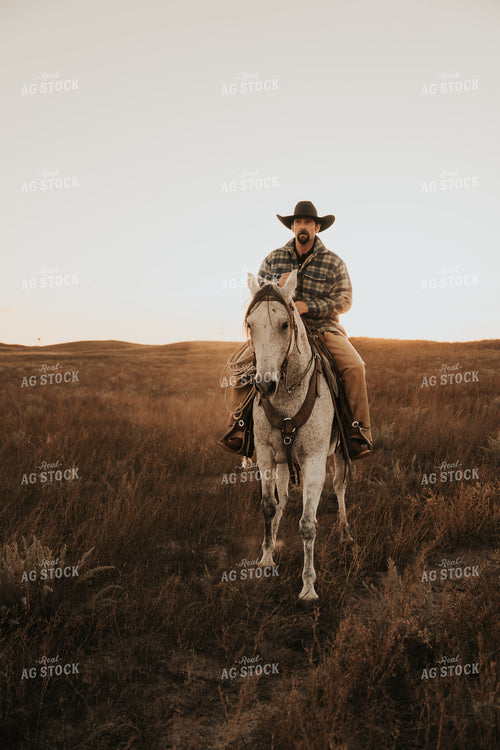 Cowboy Riding Horse 61206