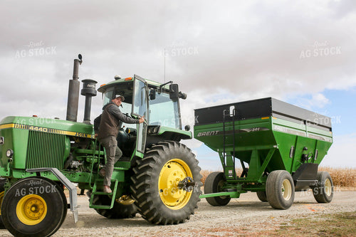 Farmer Climbing into Tractor 161062