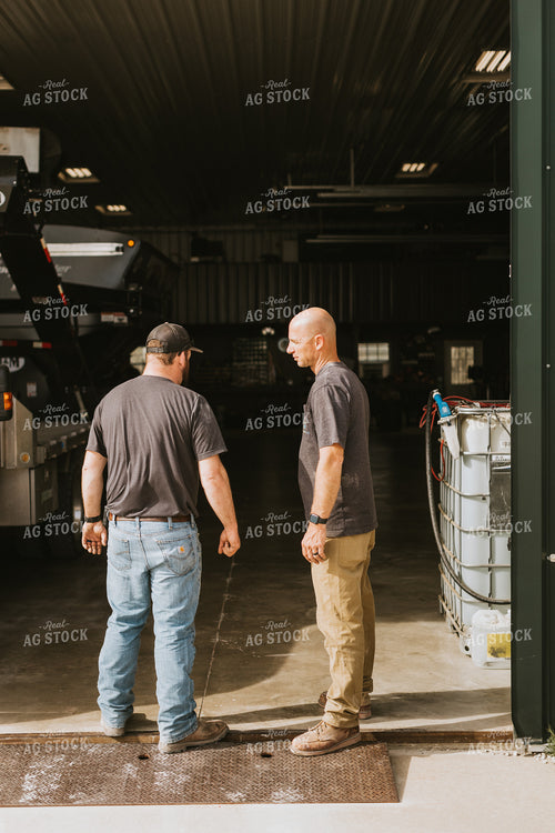 Farmers Talk Outside of Shed 7564