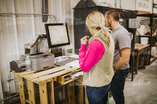 Man and Woman Running Seed Treater with Computer 5327