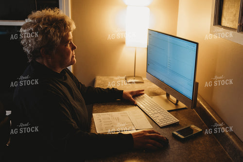 Farmer Using Computer for Farm Accounting 3699