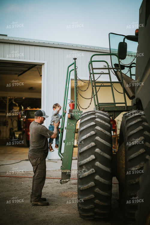Farmer and Farm Kid Working on Combine 5120