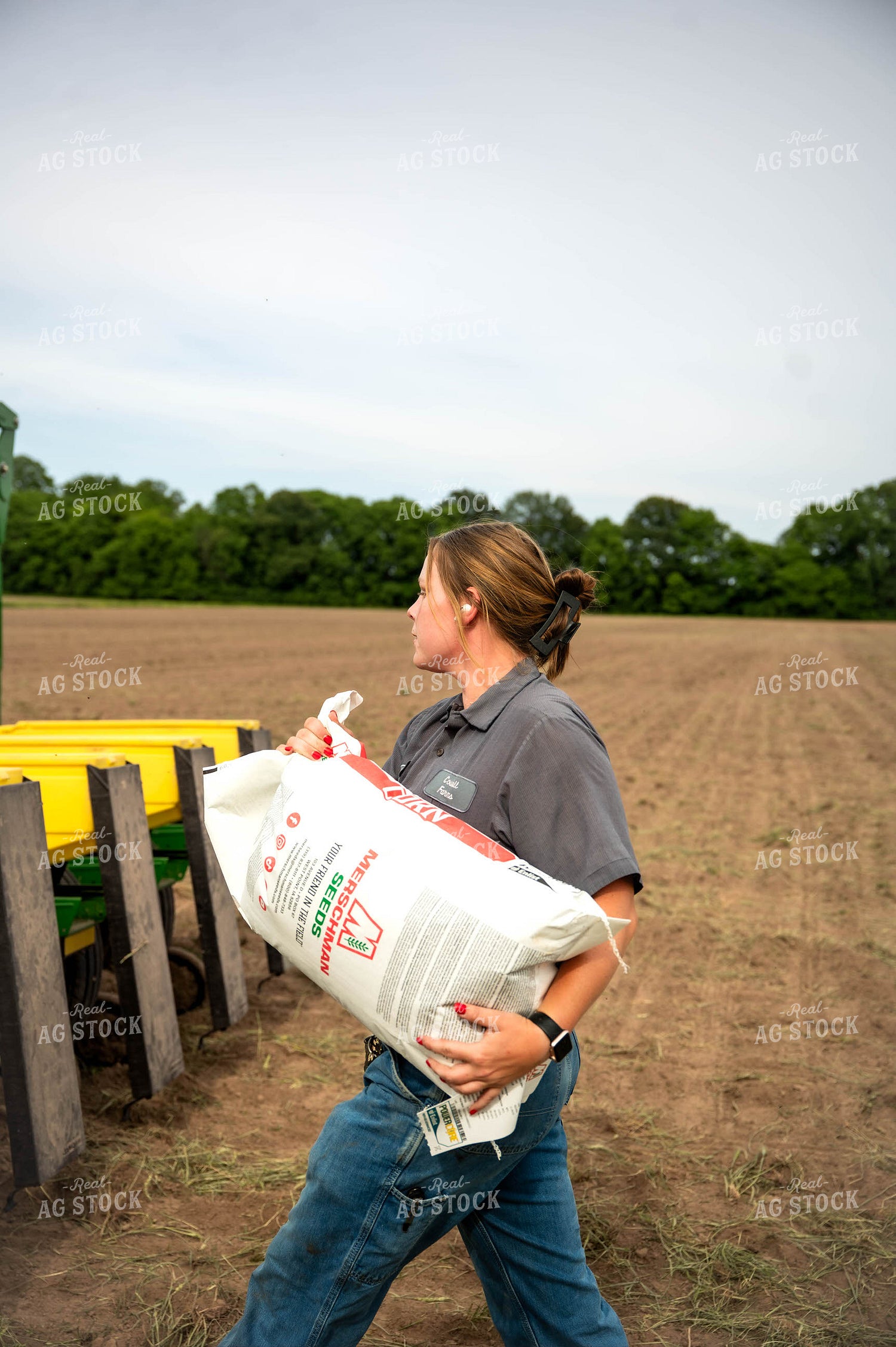 Female Farmer Filling Planter 115630
