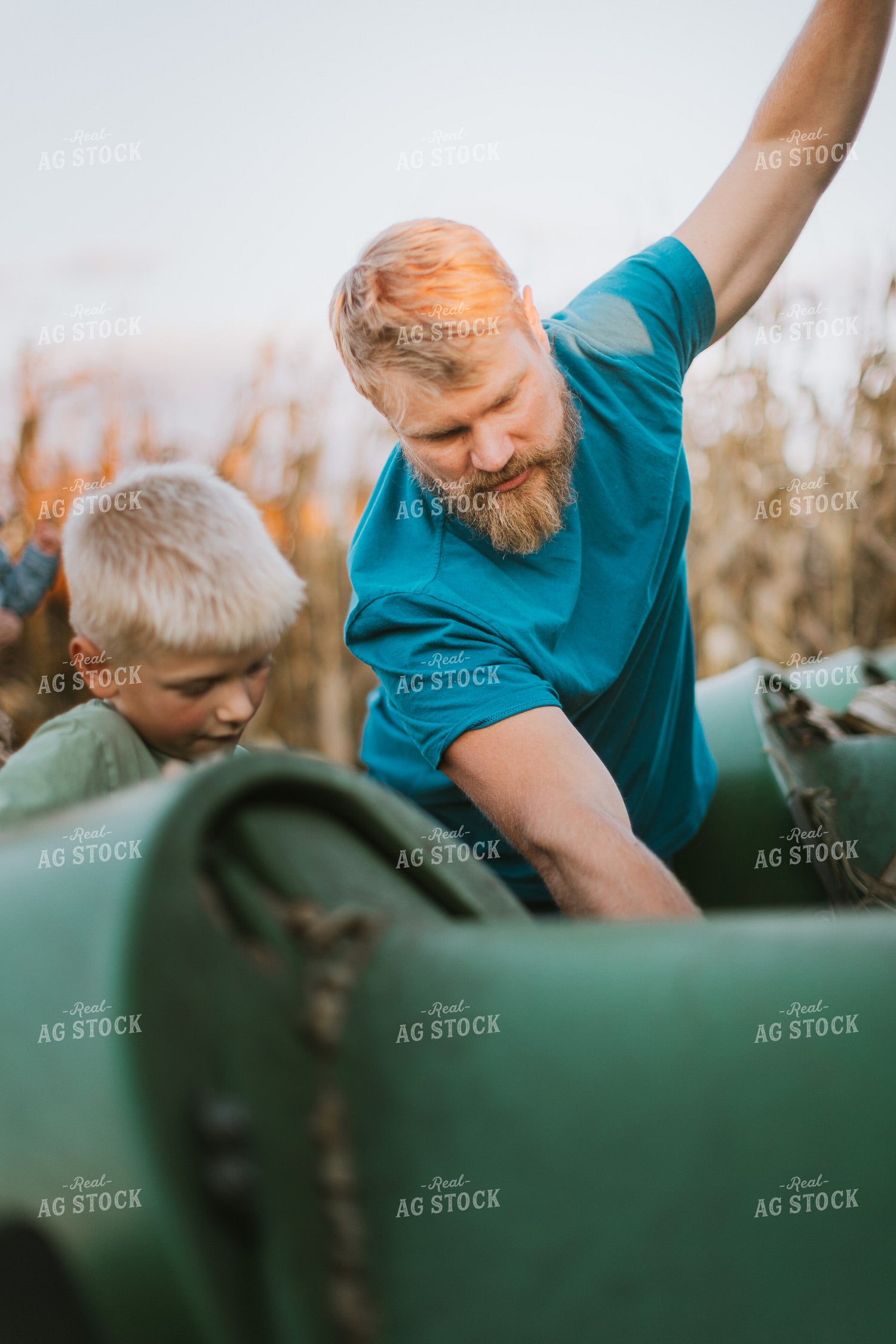 Farmer and Son Fixing Combine Head 9393