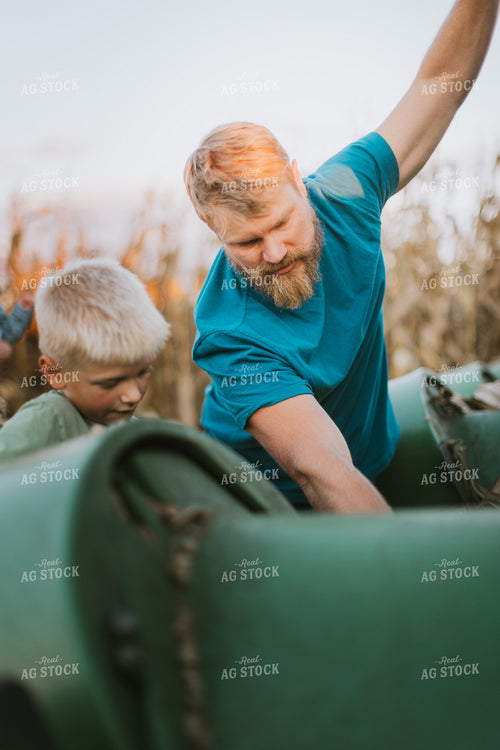 Farmer and Son Fixing Combine Head 9393