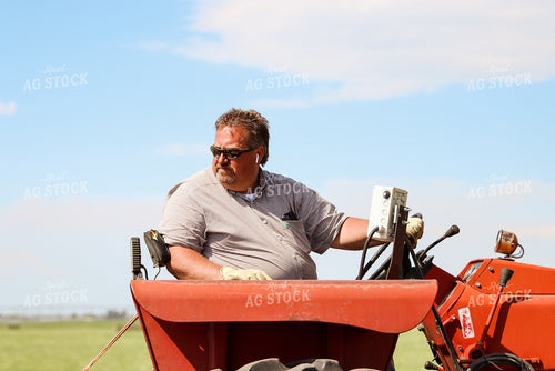 Male Farmer on Tractor 83041