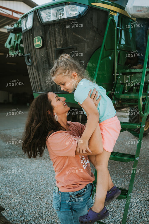 Farm Mom Helping Kids Down from Sprayer 6231