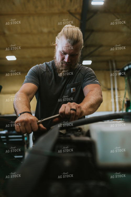 Farmer Working in Shed 6001