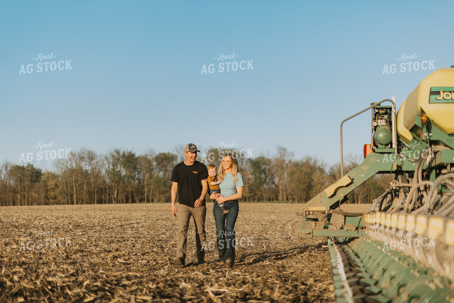 Young Couple with Child Walk Along Planter 7683