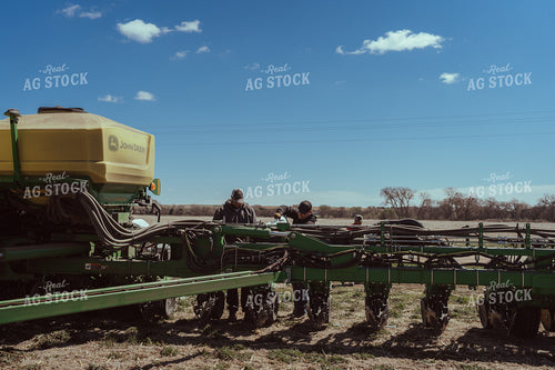 Farmer Filling Planter for Test Plot 196098