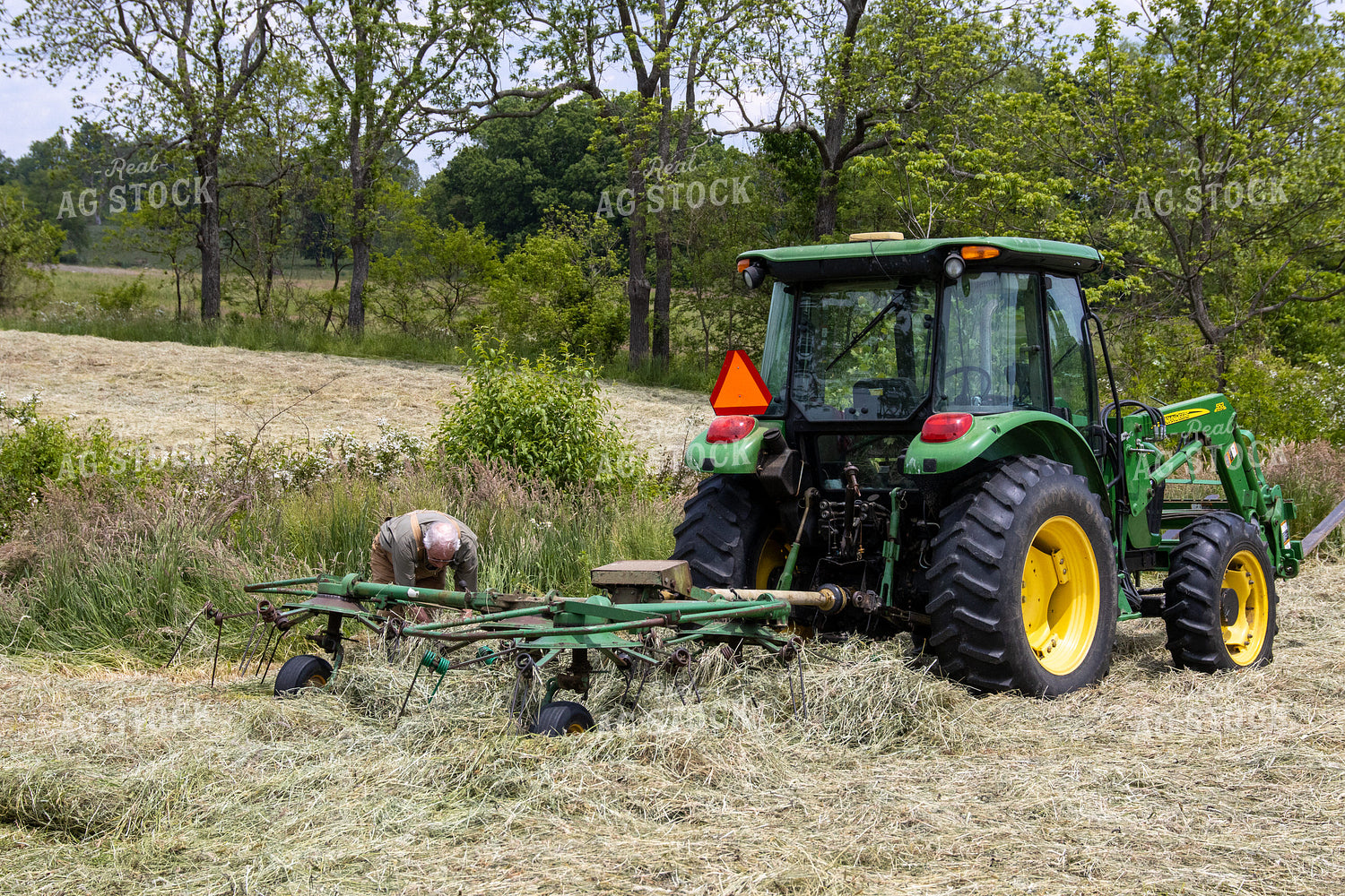 Farmer in Hay Field 52164