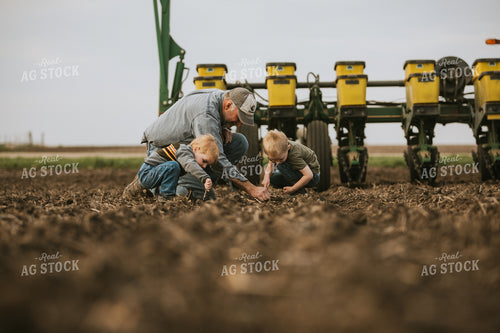 Farmer Checking Seed Depth with Farm Kids 5488